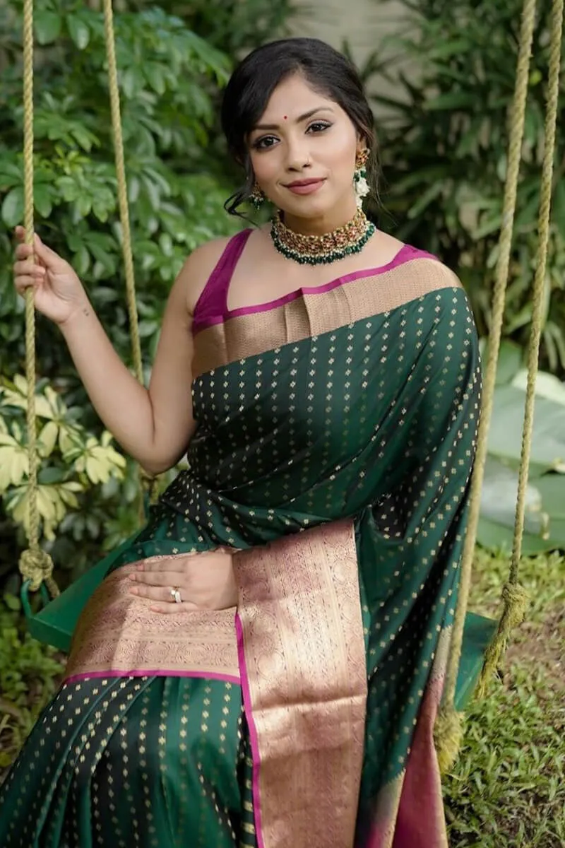 Adorning Dark Green Soft Silk Saree With Glorious Blouse Piece